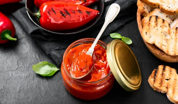 Grilled Red Pepper Sauce Lutenica Glass Jar Toasted Bread — Stock Photo, Image