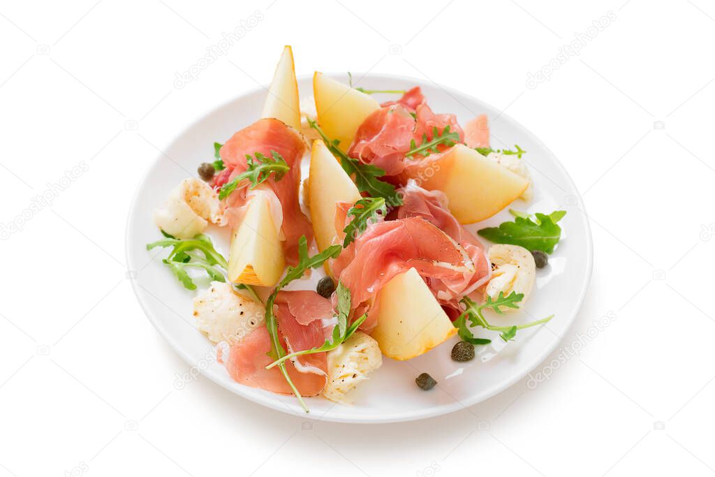 Sliced melon with ham (prosciutto) and arugula leaves.isolated on white background