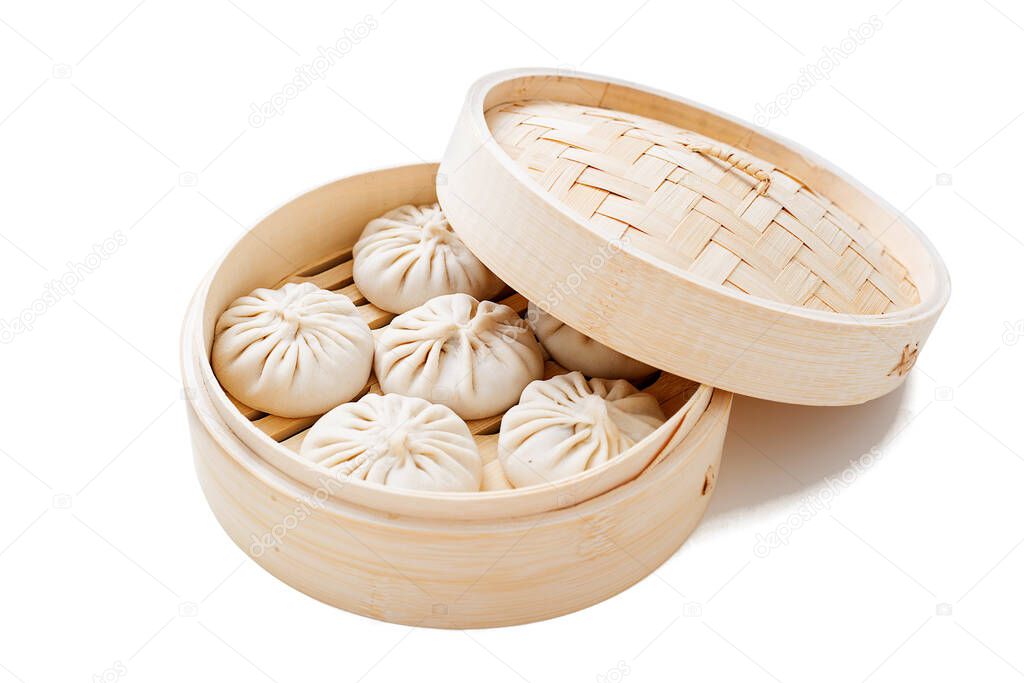 Raw dumplings Dim Sum in bamboo steamer. isolated on white background