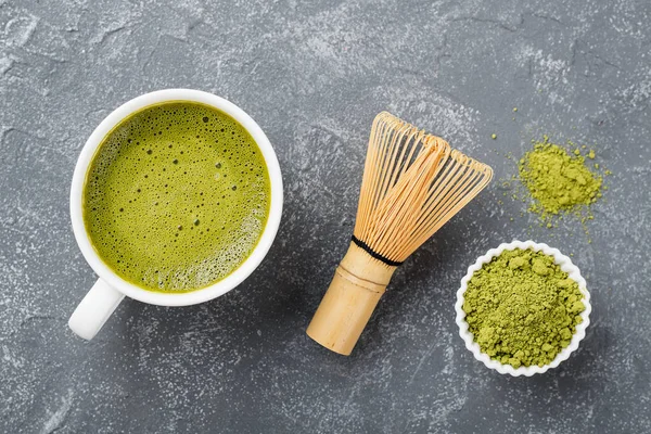 Matcha green tea latte with coconut milk. Top view.