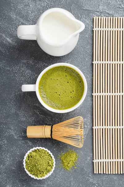 Matcha green tea latte with coconut milk. Top view.