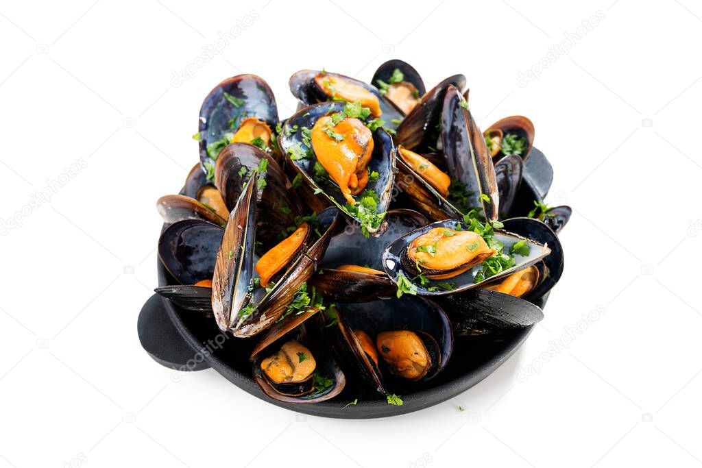 Delicious seafood mussels with parsley sauce and lemon. isolated on white background