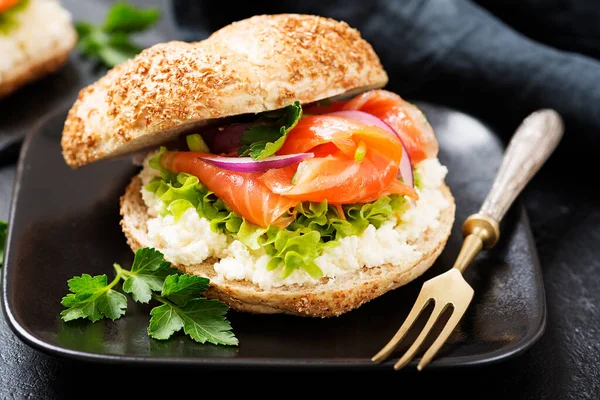 Smoked Salmon Sandwich with cream cheese for breakfast .