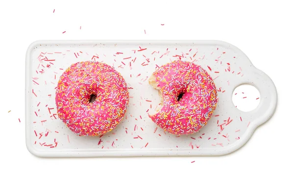 Zwei Rosa Gefrostete Donuts Mit Bunten Streusel Isoliert Auf Weißem — Stockfoto