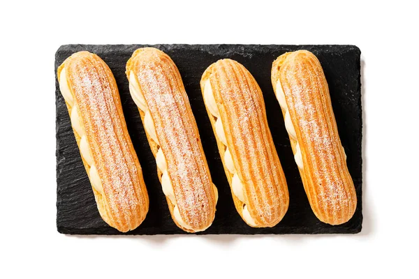 Des Éclairs Français Traditionnels Remplis Crème Vanille Sucre Poudre Isolé — Photo