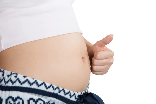 Schwangerer Bauch mit Finger-Symbol Stockfoto