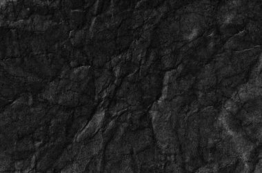 Buruşmuş kağıtlarla kaplanmış yaratıcı bir arka plan..