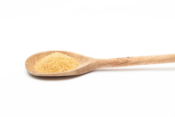 Cane sugar on the wooden spoon — Stock Photo, Image