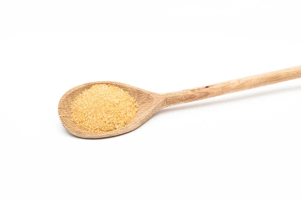 Cane sugar on the wooden spoon — Stock Photo, Image