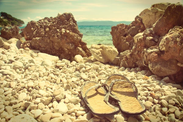 Flip-flops on the Croatian stone beach - vintage version — Stock Photo, Image