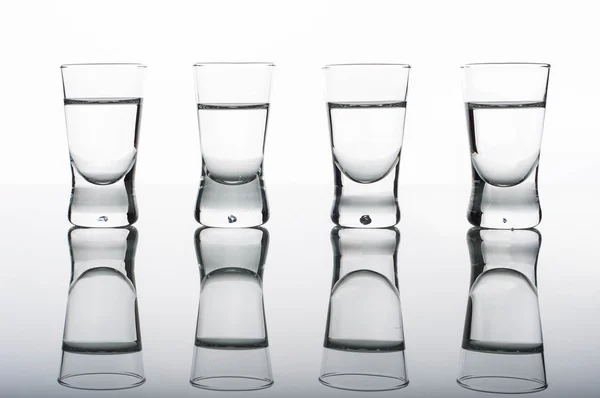 Four shots of vodka — Stock Photo, Image