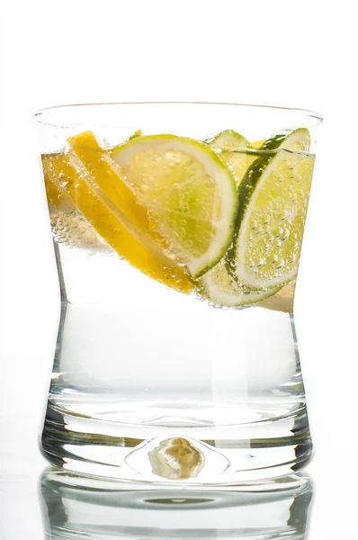 Glass of water with lemon slice — Stock Photo, Image