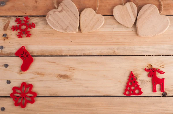 Decoración roja de Navidad en mesa de madera — Foto de Stock