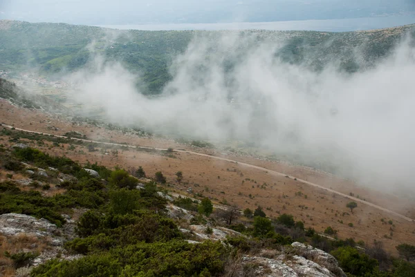 Croatian mountains  with fog and clouds — Stock Photo, Image