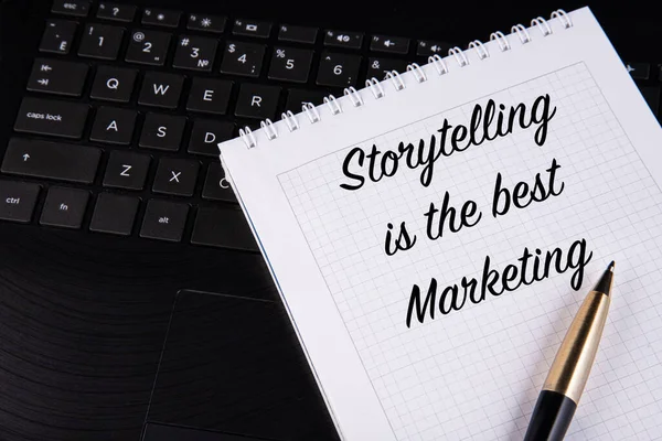 Storytelling is the best Marketing - written on a notebook with a pen. High quality photo