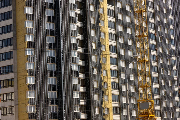 Mineral wool insulation of the facade building on construction site. Insulation for thermal protection to the shell of the house.