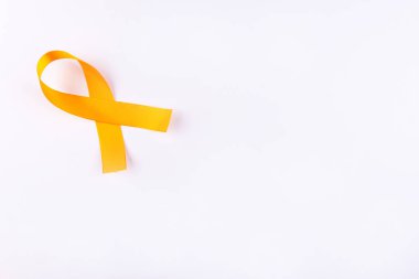 Turuncu kurdele. Lösemi farkındalığı. Sağlık ve Tıp Konsepti.