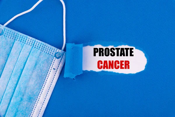 Texto Cancro Próstata Aparecendo Atrás Papel Azul Rasgado — Fotografia de Stock