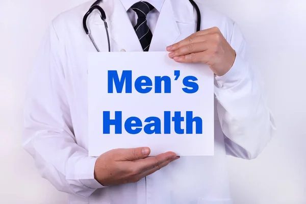 Men\'s Health card in hands of Medical Doctor