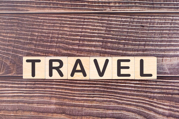 TRAVEL word made with wood building blocks