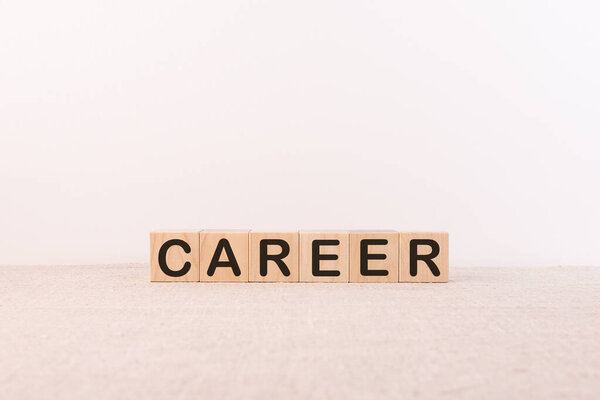 Text career sign written on wooden building blocks on a table in an office. Business concept.