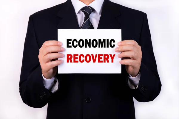 Ein Geschäftsmann Hält Ein Tablet Mit Der Aufschrift Economic Recovery — Stockfoto