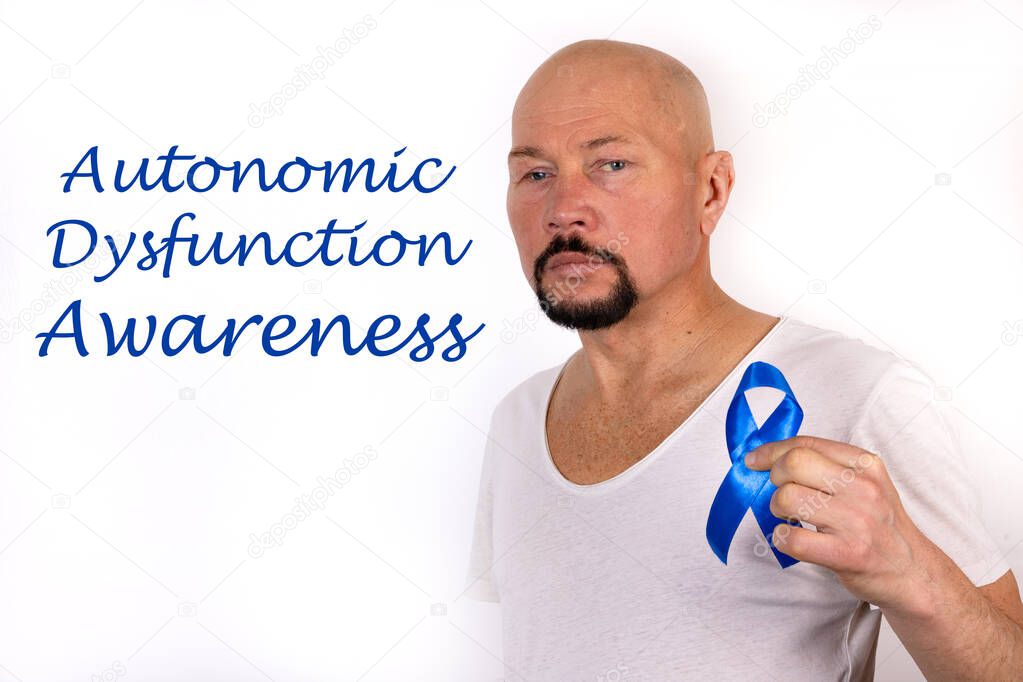 Inscription Autonomic Dysfunction Neuropathy on a white background and a nan with a symbolic blue ribbon.