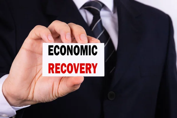 Ein Geschäftsmann Hält Ein Tablet Mit Der Aufschrift Economic Recovery — Stockfoto