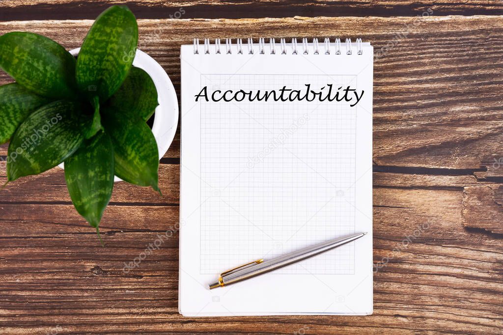 Hand writing inscription Accountability - text on notebook with a pen