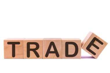 TRAD, masanın üzerinde ve arka planda duran ahşap yapı taşlarından yapılmıştır. Kavram.