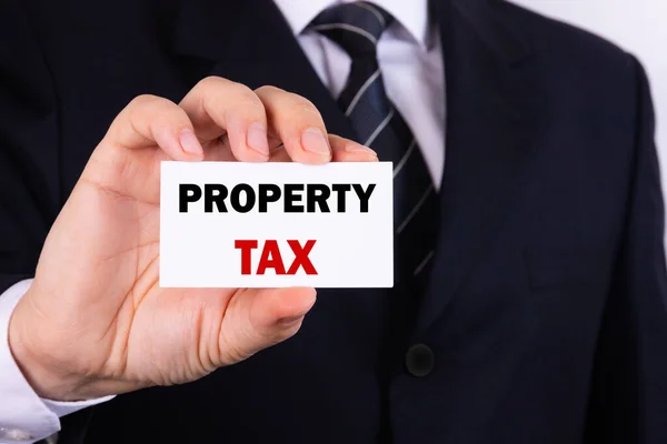 Businessman Shows Sign Text Property Tax Business Concept — Stock Photo, Image