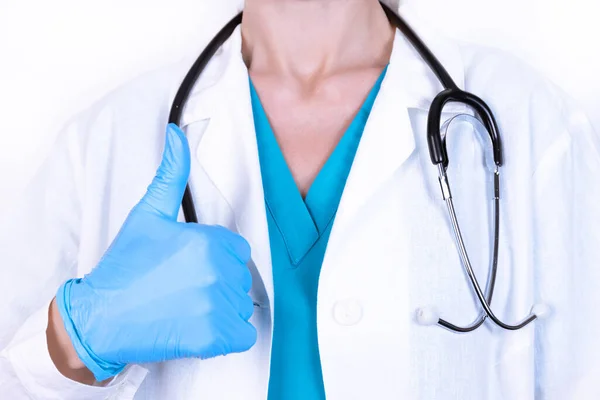 Female Doctor White Coat Disposable Gloves Stethoscope Holds Thumb — Stock Photo, Image