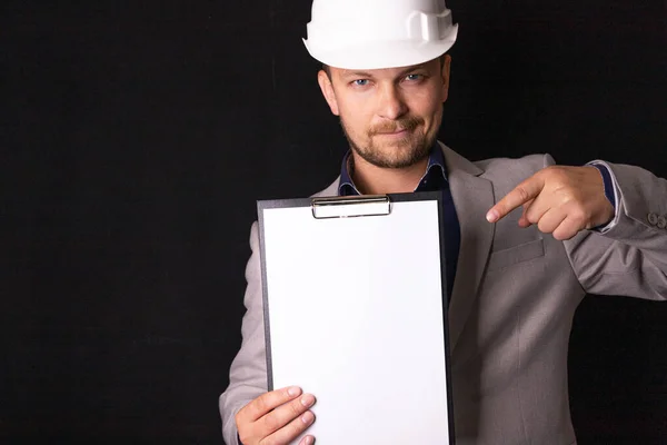 Engineer Builder Businessman White Helmet Dark Background Holds White Tablet — Stock fotografie