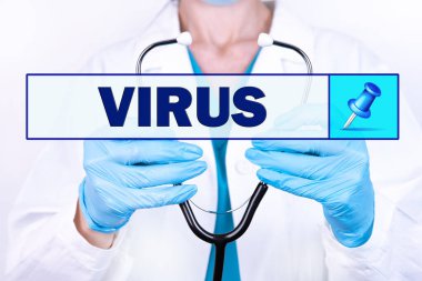 VIRUS metni, elinde steteskop tutan bir doktorun arka planında yazılıdır. Tıbbi konsept.