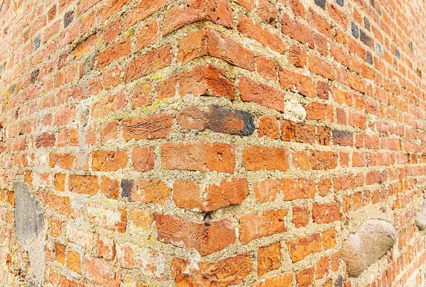 Old Brick wall surface close up. Bricks wall Texture. Loft interior and exterior design. Bricks in the wall. Brickwork close up view. Natural vintage stone walls pattern. Antique stonework Texture.