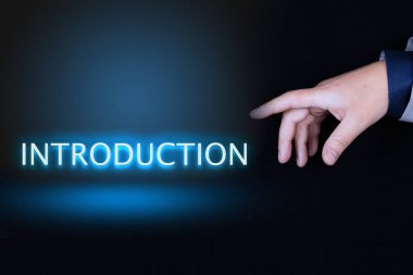 INTRODUCTION metin, siyah arkaplan üzerinde neon harflerle yazılmış kelime bir kişinin işaret parmağı ile bir el işaret.