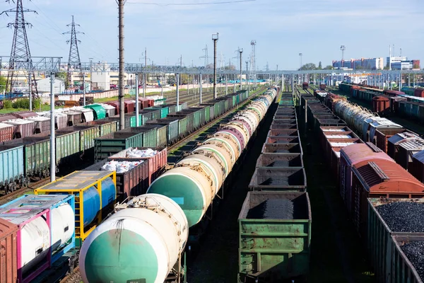 Freight railway cars at the railway station. Top view of cargo trains.Wagons with goods on railroad. Heavy industry. Industrial conceptual scene with trains. selective focus