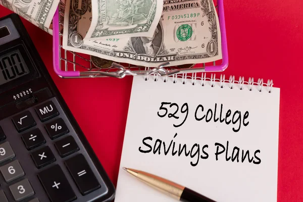 529 College Savings Plans, the text of the law is written in a white notepad with a calculator and a red background.