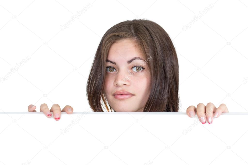 Girl peeks out from behind the screen