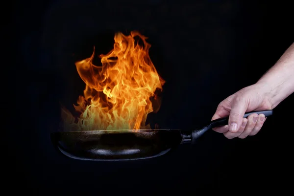 Fire on frying pan — Stock Photo, Image