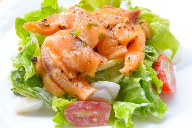 Grilled salmon salad With black pepper sauce clipart