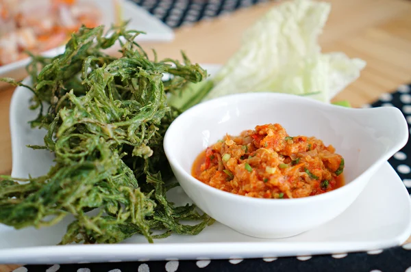 Thai chilli spicy sauce with fried and fresh vegetables on white — Stock Photo, Image