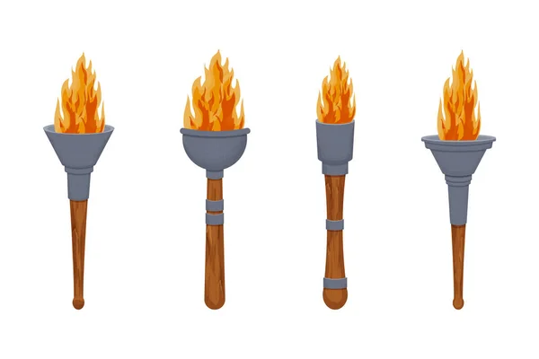 Set torche médiévale avec flamme dans le style dessin animé isolé sur fond blanc. Lampe antique, symbole du treuil. ui actif du jeu. — Image vectorielle