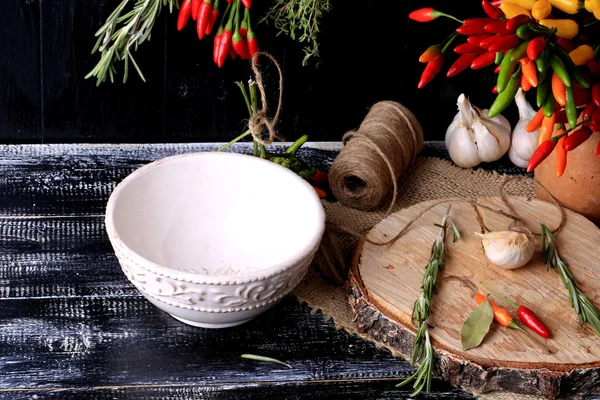 Empty ceramic bowl on the old wooden background spices rustic style — Stock Photo, Image