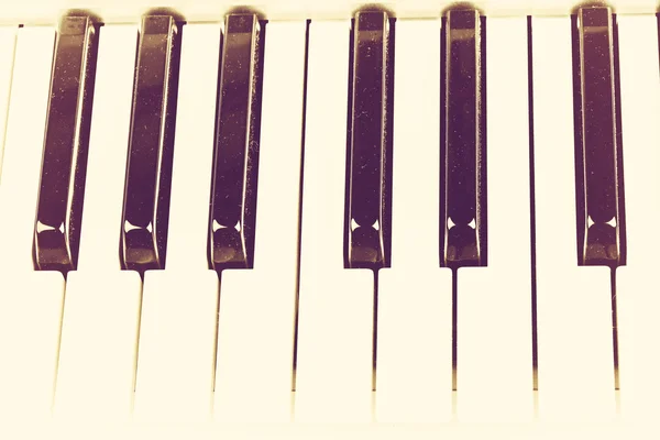 Piano keyboard in vintage retro style musical background — Stock Photo, Image