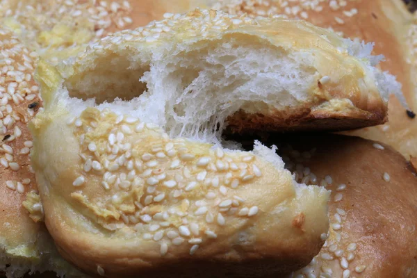 Fresh bread buns with sesame garlic home baking rustic style selective focus — Stock Photo, Image