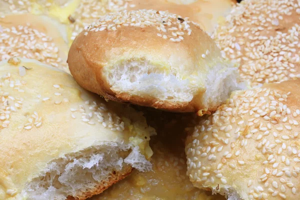 Fresh bread buns with sesame garlic home baking rustic style selective focus — Stock Photo, Image