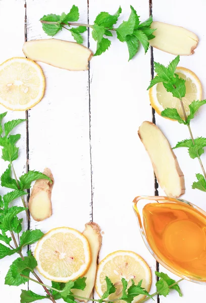ginger honey lemon mint on a white wooden background ingredient for homemade lemonade rustic style flat look view from above over head