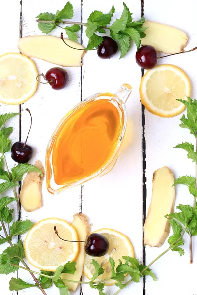 Ginger honey lemon mint cherry on a white wooden background ingredient for homemade lemonade rustic style flat look view from above over head — Stock Photo, Image