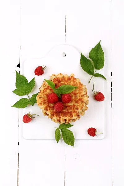 Waffles with raspberries for breakfast on white wooden background top view flat style overhead — Stock Photo, Image